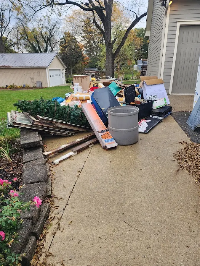 Dumpster being loaded with debris for Estate Cleanout Dumpster Rental in Marysville